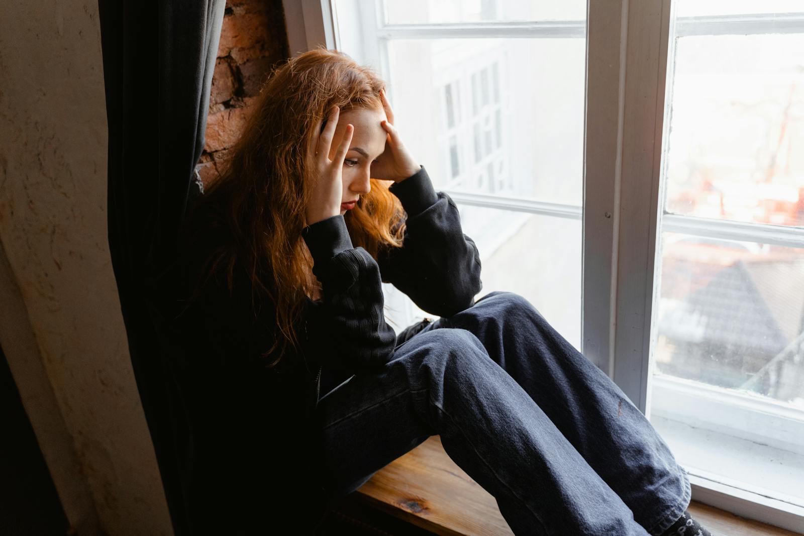person deep in thought alone