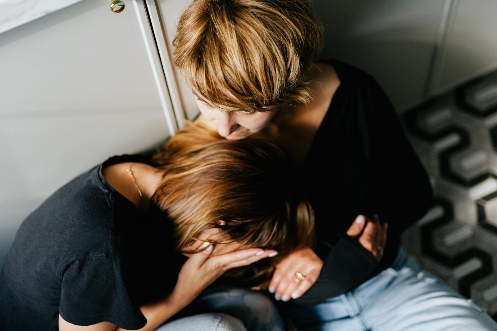 person comforting friend