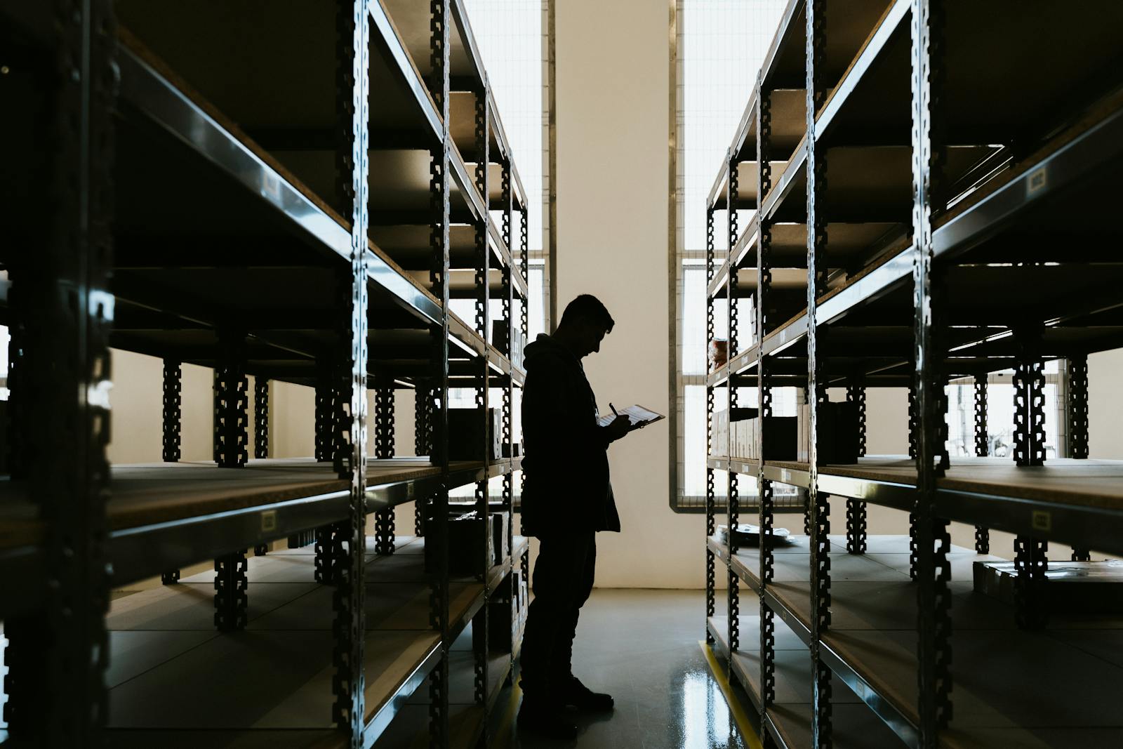 person organizing shelves