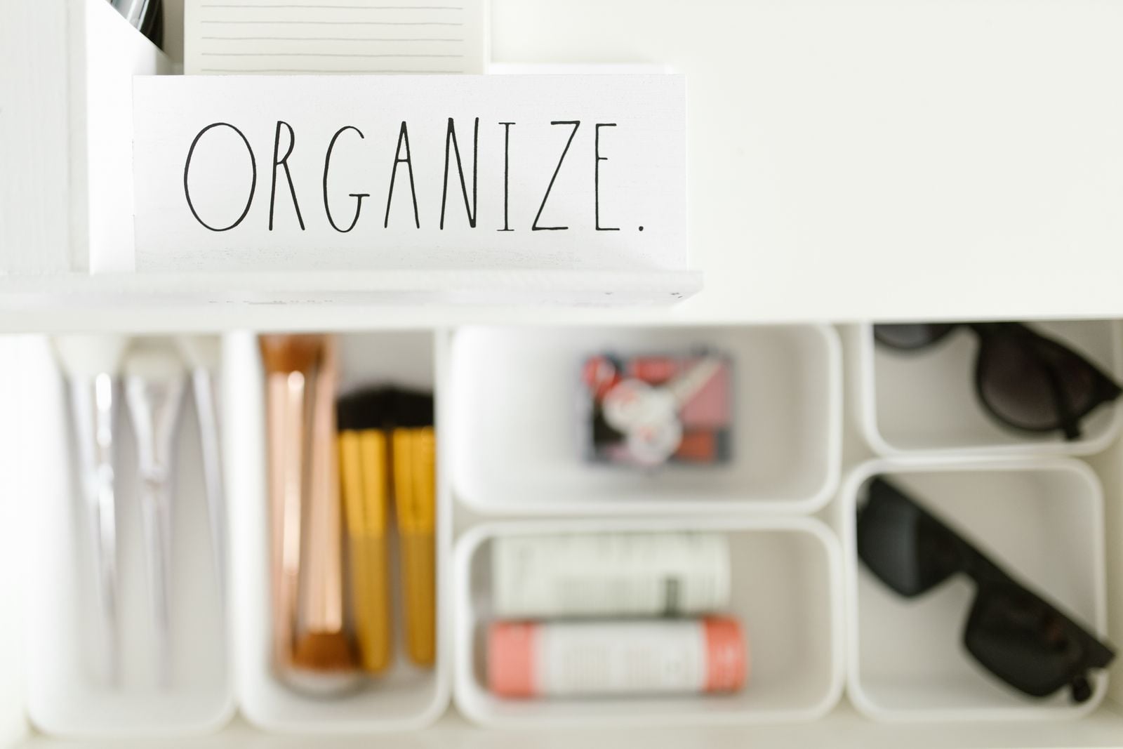 hands tidying small space