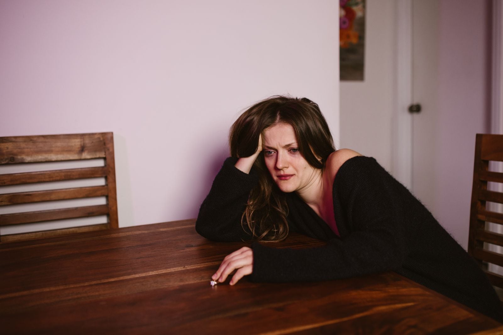 woman crying alone kitchen