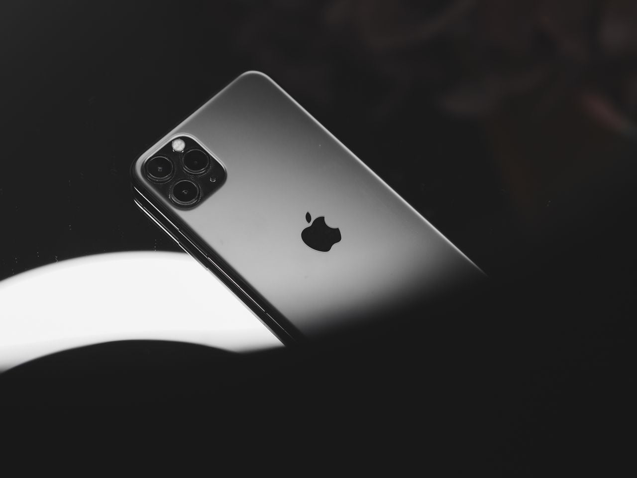 Nobody is asking why Apple filed its OpenAI trade secrets suit now, weeks before a rumoured public listing — and the answer sits inside a screenless device shaped by the more than 400 ex-Apple hires OpenAI has quietly made