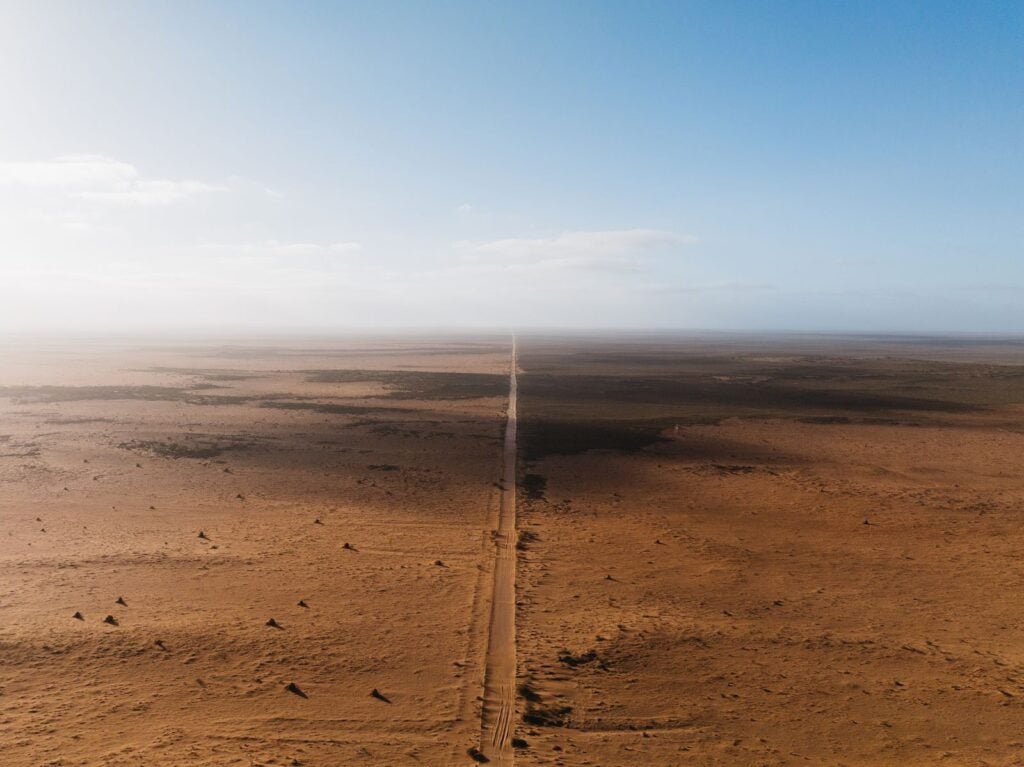 Olympus Mons on Mars rises 22 kilometres above the surrounding plain but its slopes are so gradual that a hiker standing on its flank would see nothing but flat ground stretching to the horizon in every direction